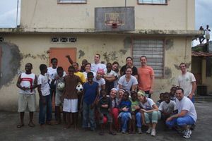 Group photo with the children from fraternite des jeunes orphanage|University of scranton students with 11th grade students from|Playing red rover with the children from fraternite des jeunes orphanage