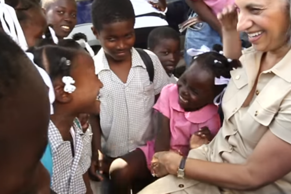 JoAnne Founder smiling with children